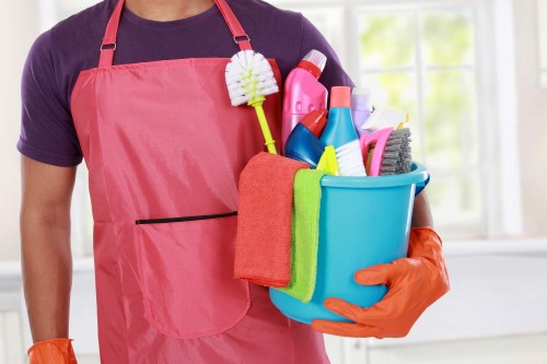Technician preparing carpet cleaning equipment in a safe indoor setting