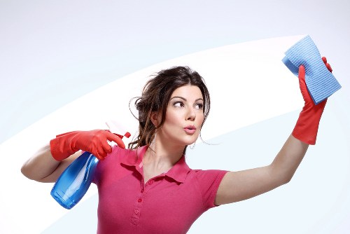 Close-up of safe carpet cleaning products and protective gloves